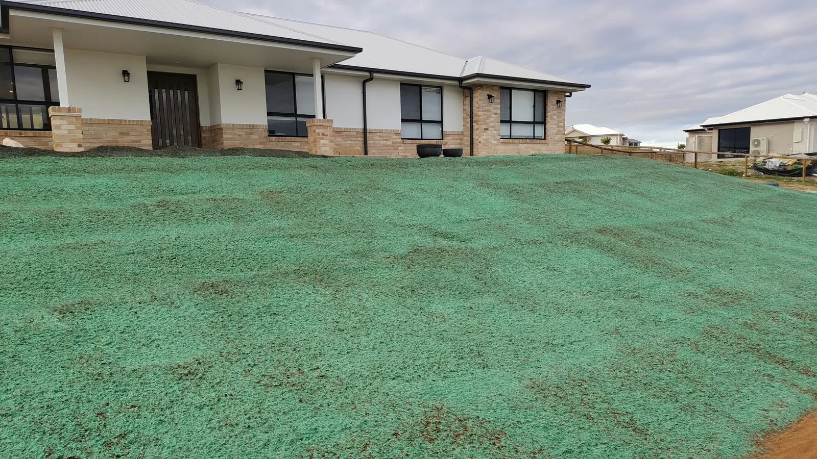 Freshly hydromulched new lawn in South East Queensland, day one of hydroseeding aftercare